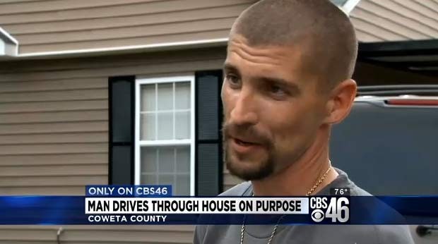 Man drives truck through his house on purpose