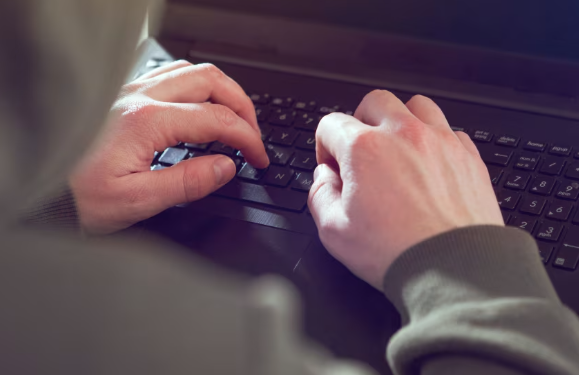 Two men accused of hacking and extorting US companies